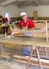 JPEG 73KB - Jerry Purkaple doing the finish work on a lecturn.