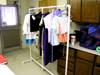 JPEG 117KB - A rack of children's clothes that our wives made.