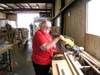 Freda Berry is using the chop saw to make little boards from big boards.  One of our tasks is to be able to make a person (including our wives) immediately productive.