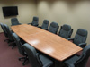 Both sections of the completed conference table set up in their conference room.
