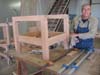 Ken Beazley is cleaning the glue of one of many cargo chairs we built