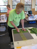 Elaine Strong cuts pieces for one of the quilts.