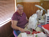 Freda Berry works on clothes for an orphanage in Africa.
