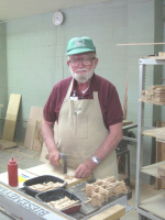 We use scrap pieces of wood to make several small items for the camps to use as givaways.  Stan Foskett is assembling small crosses.