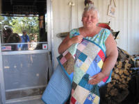 Our wives sewing ministry made a quilt for the very appreciative lady.