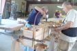 Harold Cheatheam and Jim Strong are putting together a glueup of a stack of boards to be used for bed posts.