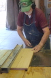 Gayle Berry is making a smaller board out of a bigger one on one of our table saws.