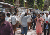 JPEG 65KB - This is a local street scene with several major bookstalls located on the sidewalk.  Many of the authors we know and love are available at very cheap prices.  They are printed in India and can only be legally sold in India.  The quality of the books is extremely poor, but who cares in a paperback when you're only paying a little more than a dollar.