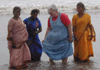 JPEG 38KB - This is the way Indian women go swimming in the ocean.  They get wet up to the waist in their everyday clothing.  Most of them would not even go to this far, but would sit on the shore and watch the men swimming.  These ladies wanted us to take their picture and we were happy to oblige.