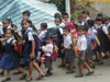 JPEG 62KB - School children on their way home.  Nearly all schools here have uniforms.